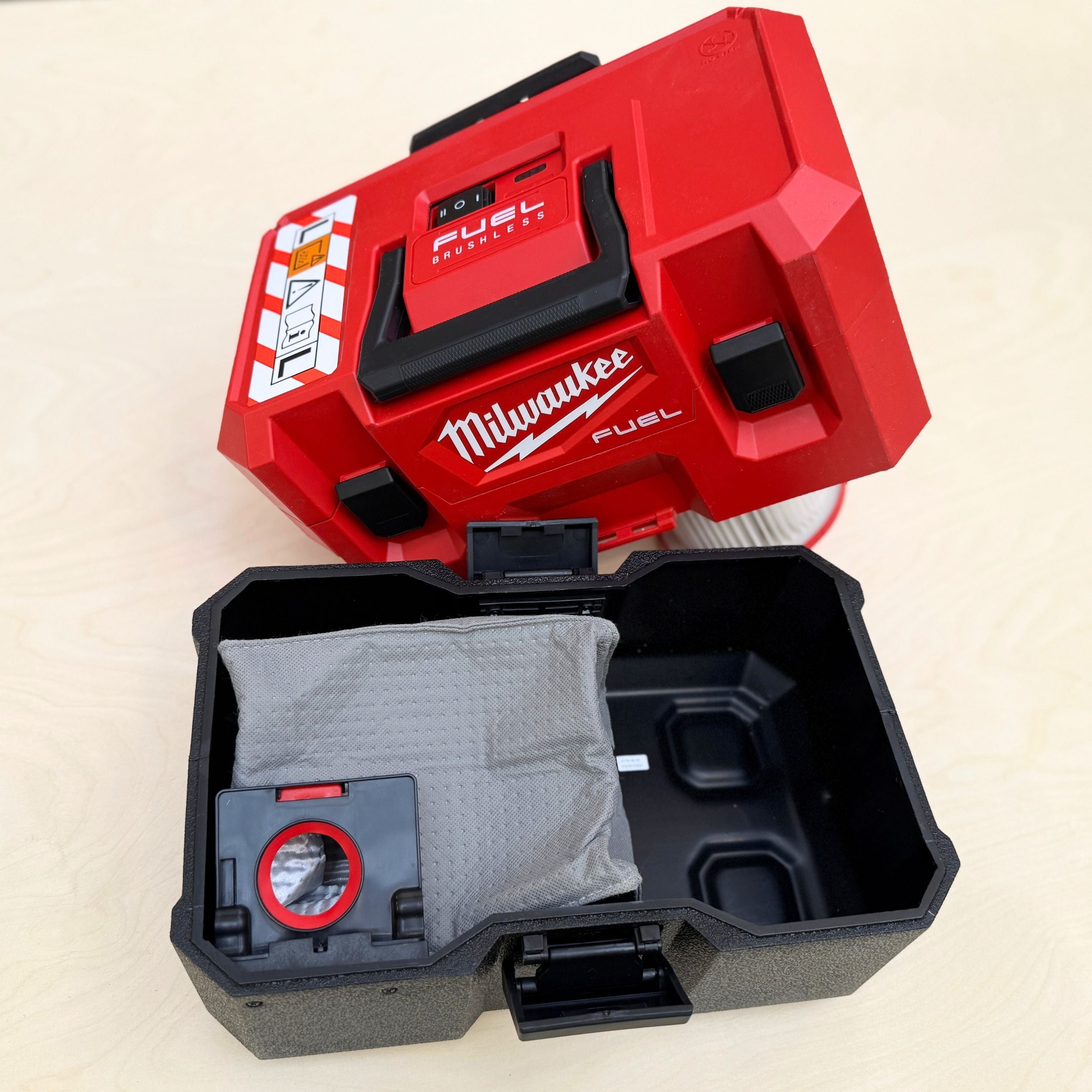 Reusable dust bag for Milwaukee M12 Fuel emptied and shaken out for reuse