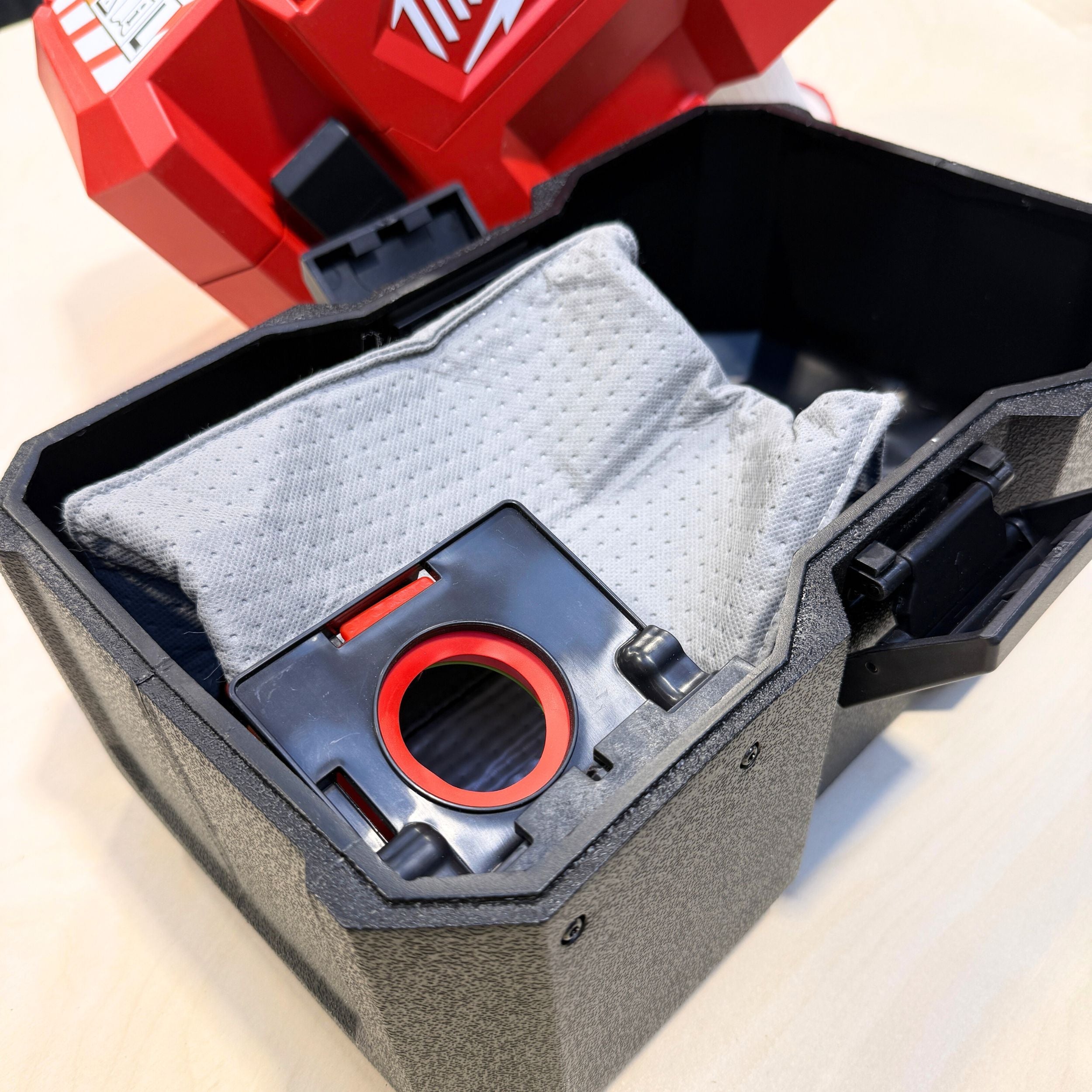 Close-up of the reusable dust bag fabric and collar for Milwaukee M12 Fuel